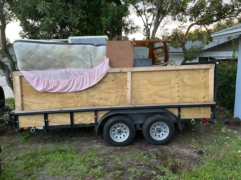 ER Junk Removal Team Hauling away furniture from a Residential Cleanout